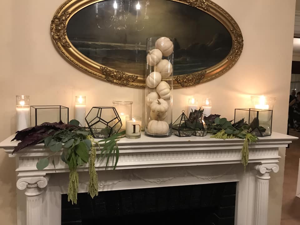 candles, white gourds on mantle