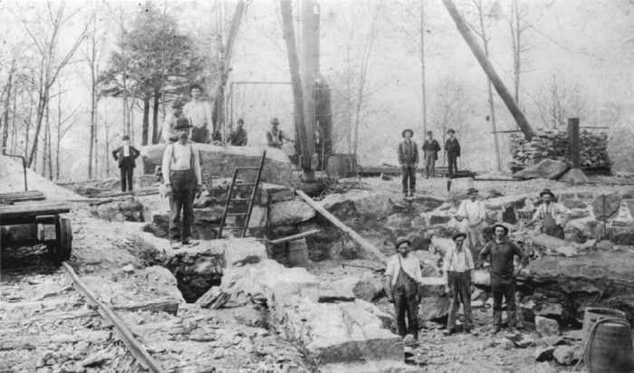 Hearthstone Castle Work Crew black and white photo of "Mad Hatters" working to mine limestone for the Hearthstone castle