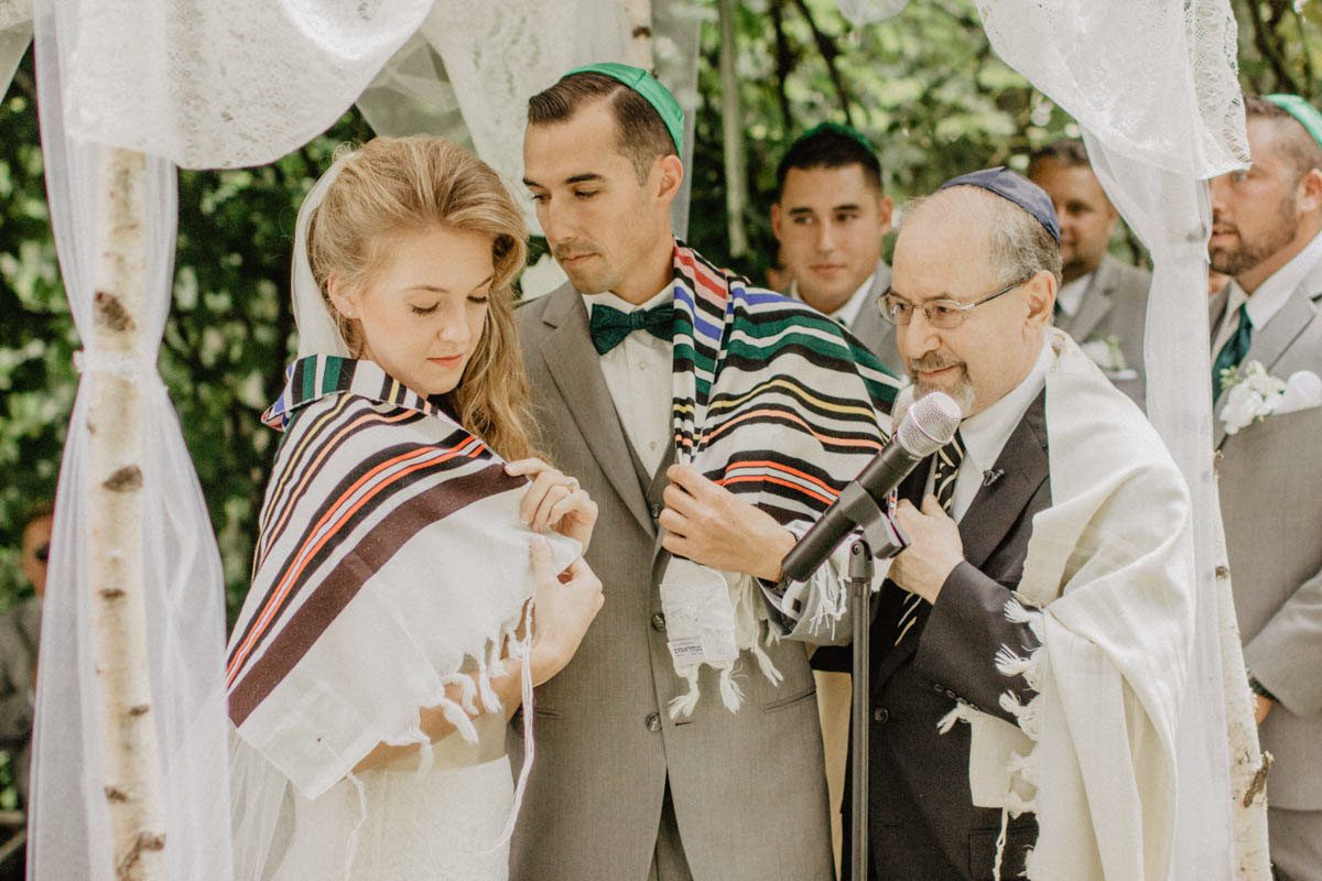 jewish-wedding-ceremony-shawl-draped-over-couple during-ceremony