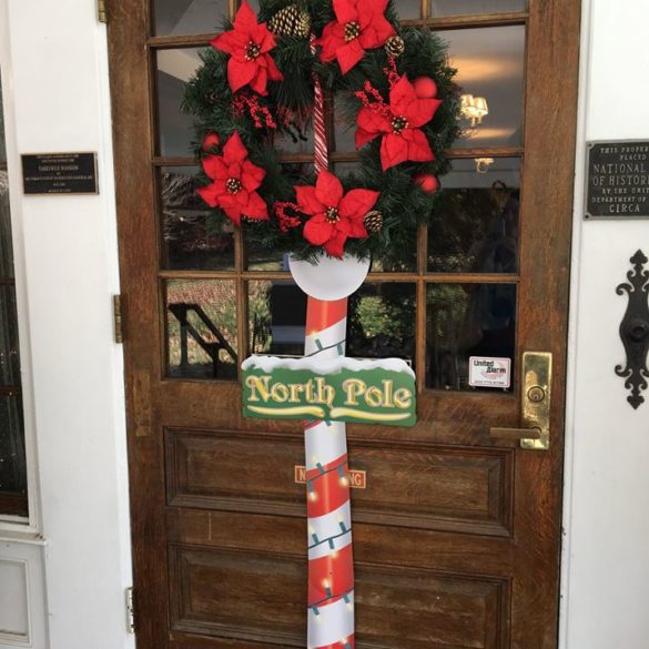 tarrywile door with north pole candy cane