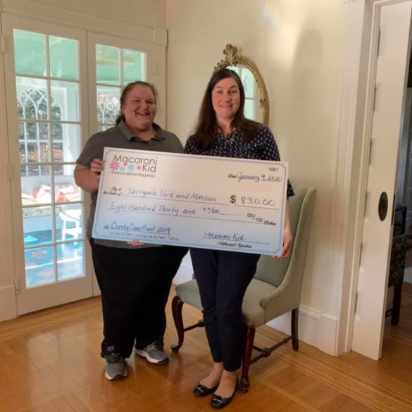meghan presenting big check to becky